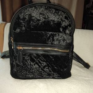 3 AM Forever black backpack.